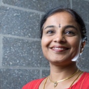 Poorna Viswanathan smiles for a photo. 